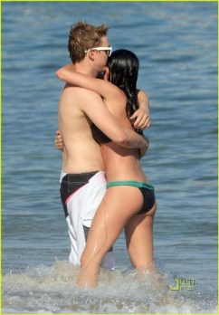 Jesse McCartney embraces his new girlfriend Jasmine Waltz on the beach in Malibu, CA.